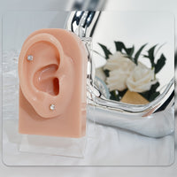 Pair of 4mm White Synthetic Zirconia Earrings with Floral Relief Design and
