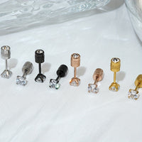 Pair of 4mm White Synthetic Zirconia Earrings with Floral Relief Design and