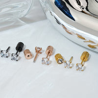 Pair of 4mm White Synthetic Zirconia Earrings with Floral Relief Design and